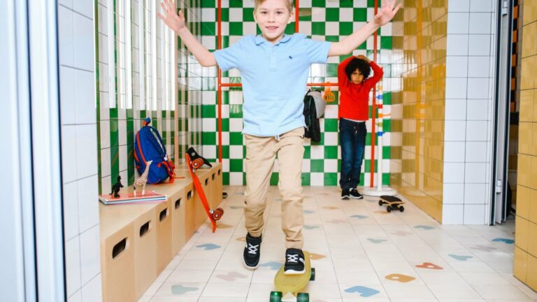 A boy crossing an obstacle course in a play room