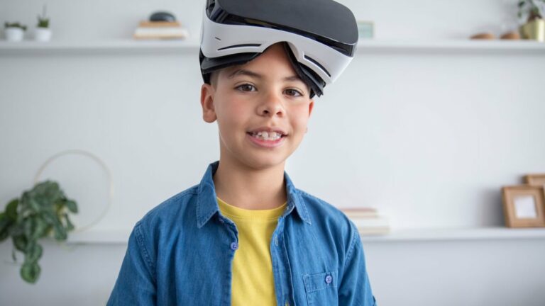 A boy wearing a virtual reality headset